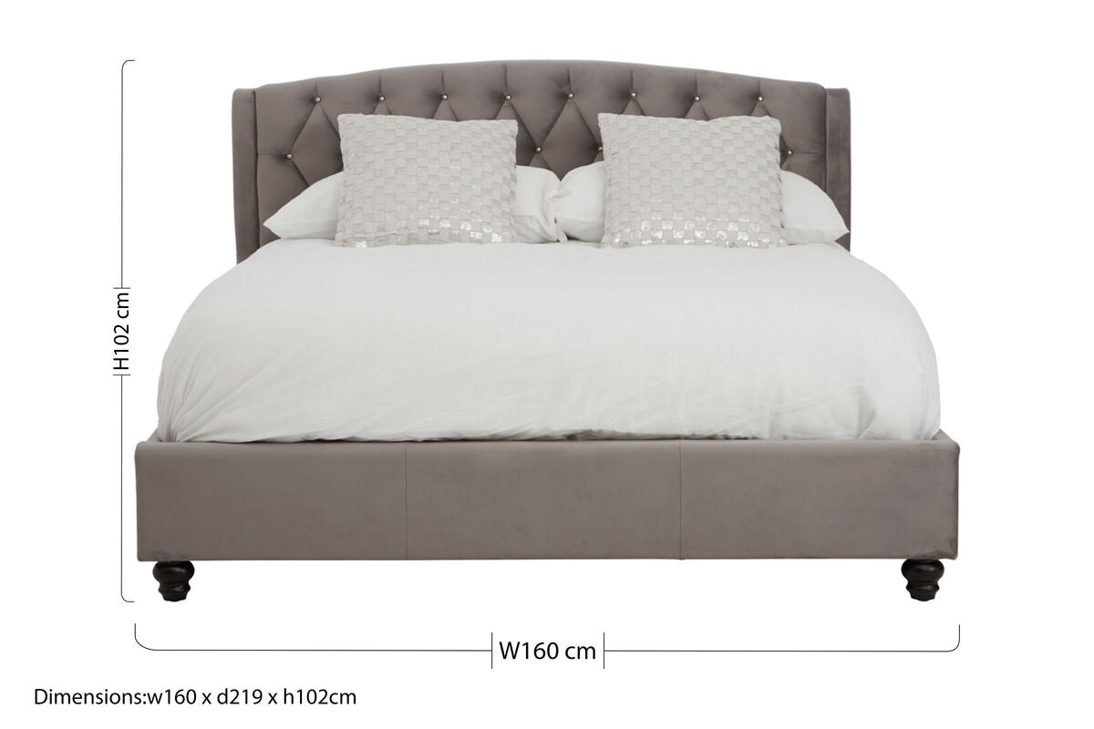 Orsina Josephine Grey Velvet King Bed with tufted headboard and sleek wooden legs in a modern bedroom setting.
