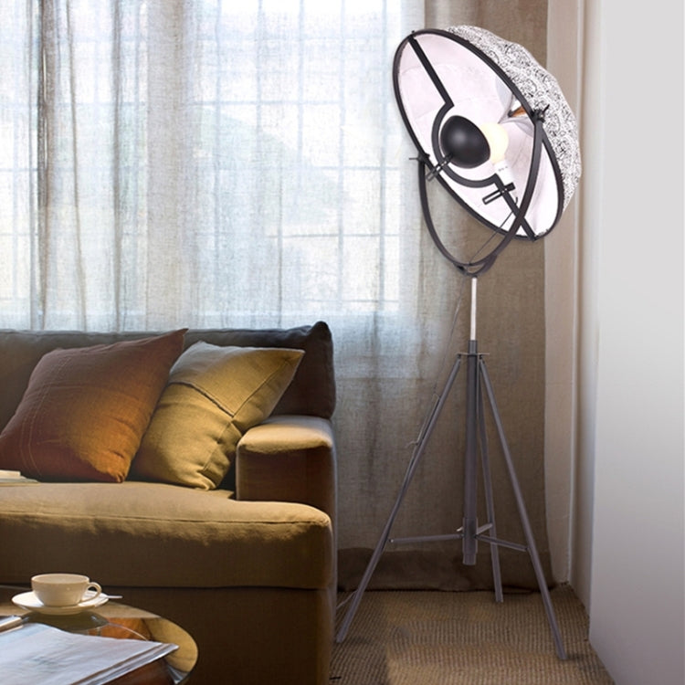 Industrial-style Satellite Studio Tripod Floor Lamp by Mira Sales with adjustable spotlight and sturdy metal tripod stand.