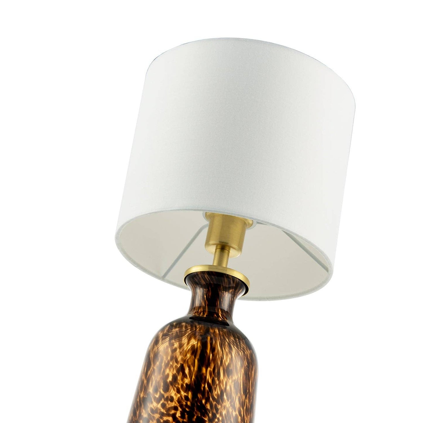 Modern amber and black snowflake speckle glass table lamp with shade, featuring a sleek design and decorative pattern.