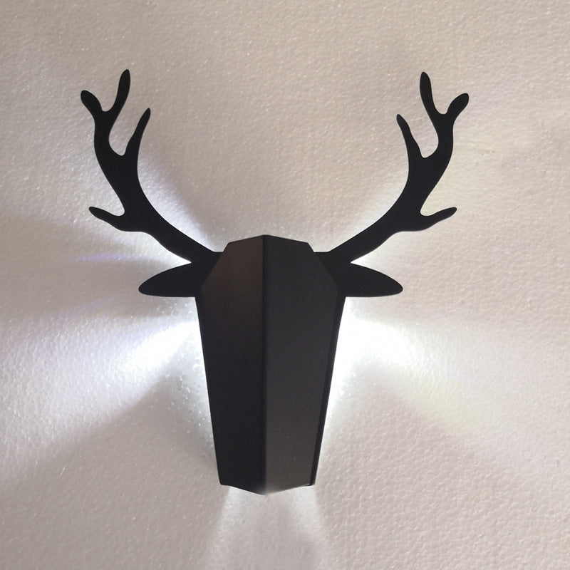 Decorative living room wall lamp by Michan Direct with modern design and warm lighting, mounted on a neutral-colored wall.