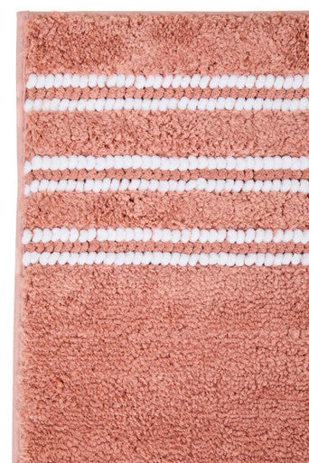 Dusky pink large bath mat from Orsina with plush, absorbent texture, perfect for bathroom decor and safety.