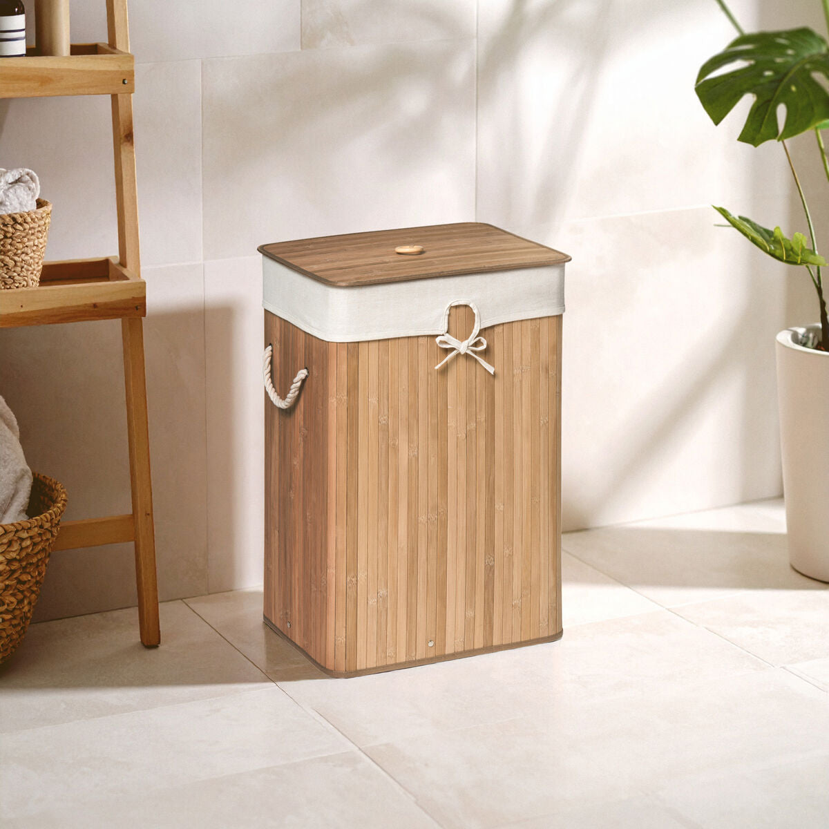 Orsina Kankyo rectangular laundry hamper made of natural bamboo, designed for storing and carrying laundry efficiently.