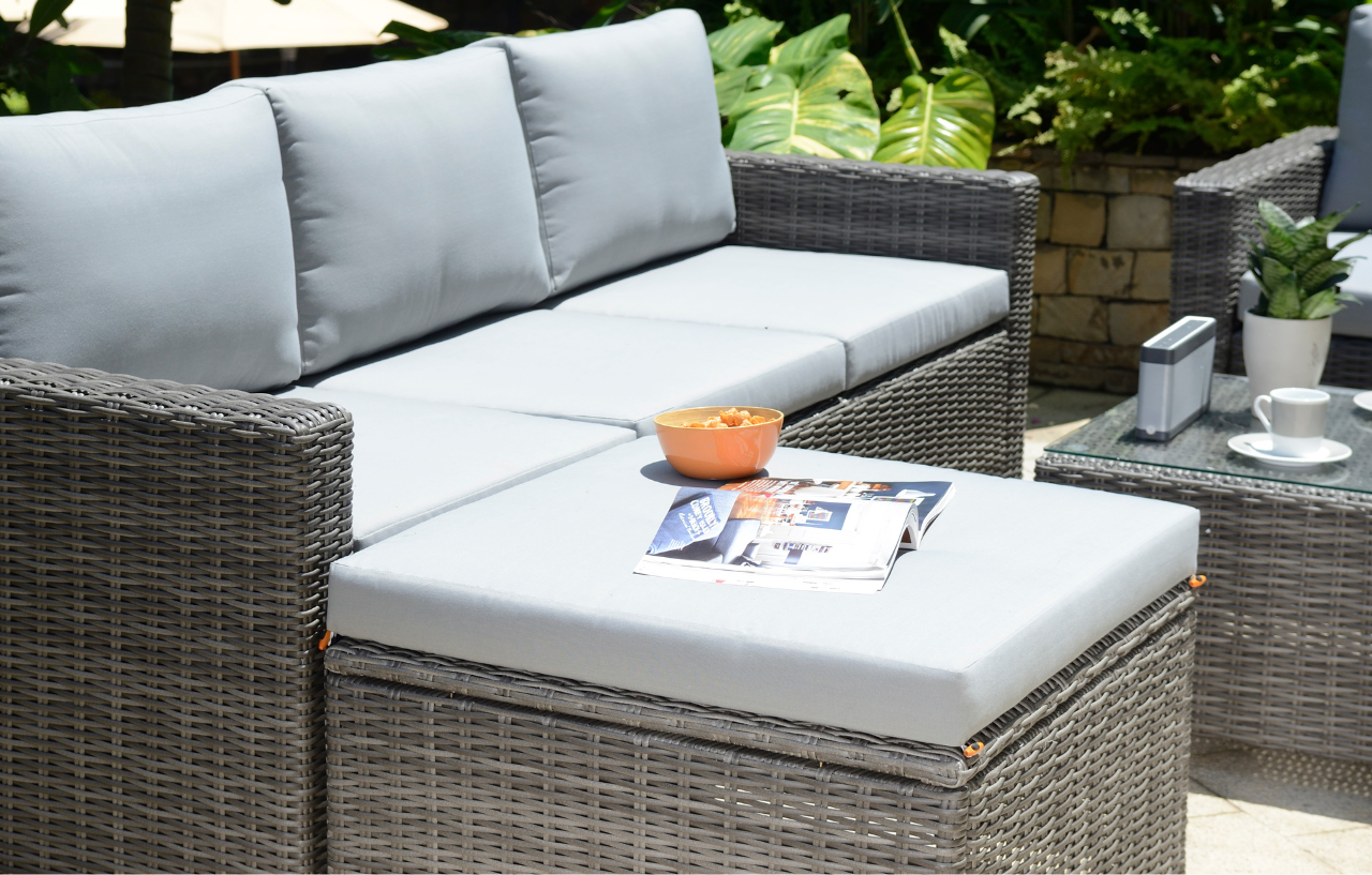 Marbella grey 5-seater garden sofa set with matching ottoman and protective cover, featuring outdoor wicker furniture and cushions.