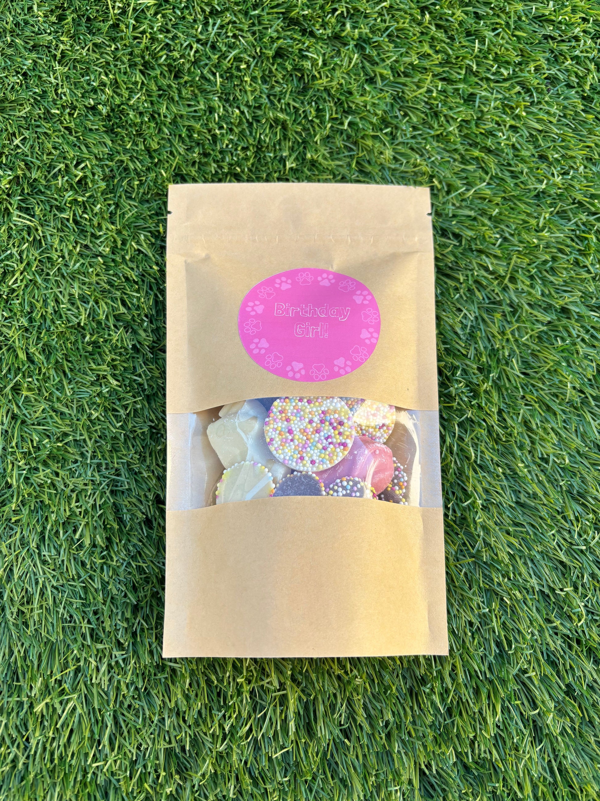 The Bonnie Hound Happy Barkday Treat Pick n Mix chocolate treats in a 150g bag, featuring assorted dog-friendly chocolates and colorful packaging.