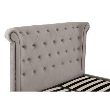 Orsina Edison grey velvet double-bed ottoman with plush upholstery and storage space, shown from a side view.