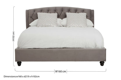 Orsina Josephine Grey Velvet King Bed with tufted headboard and sleek wooden legs in a modern bedroom setting.