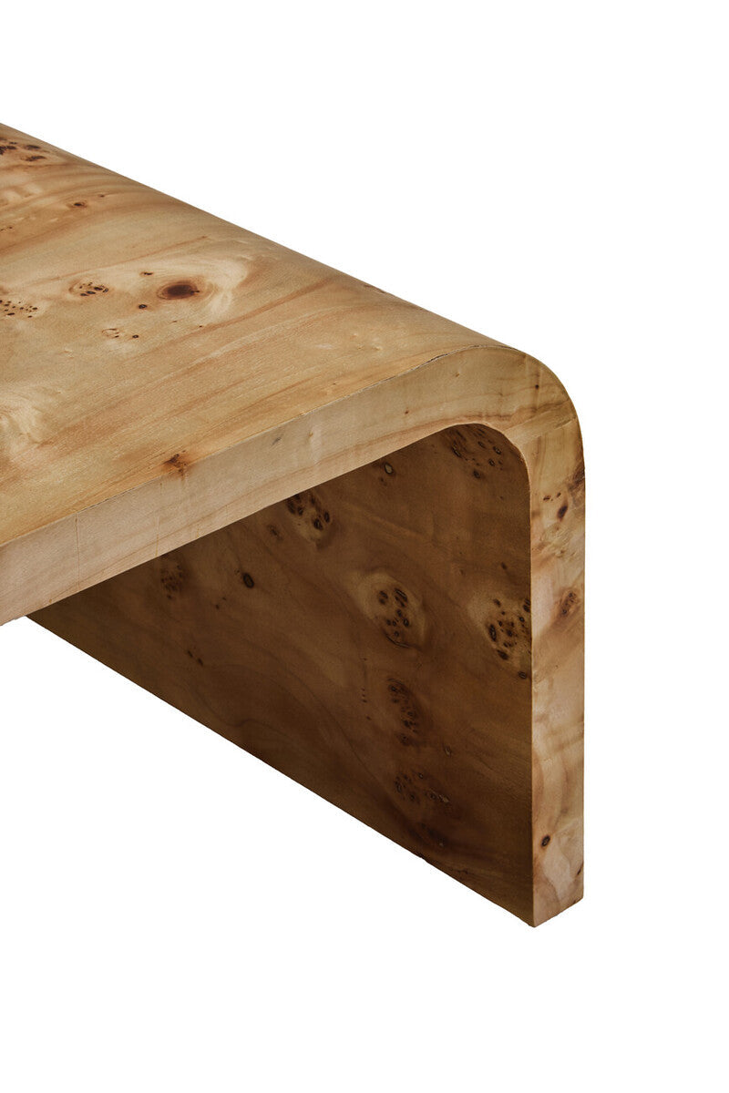 Natural burl wood curved coffee table with smooth edges by Orsina, showcasing its elegant, polished surface and curved design.