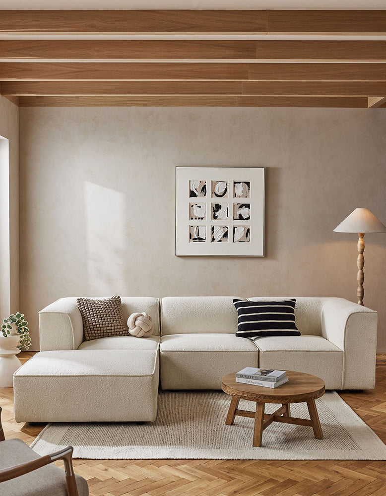 DC Concept Van Dyke Modular Sofa, three-seater corner sofa with plush cushions and modern design, shown in a spacious living room setting.