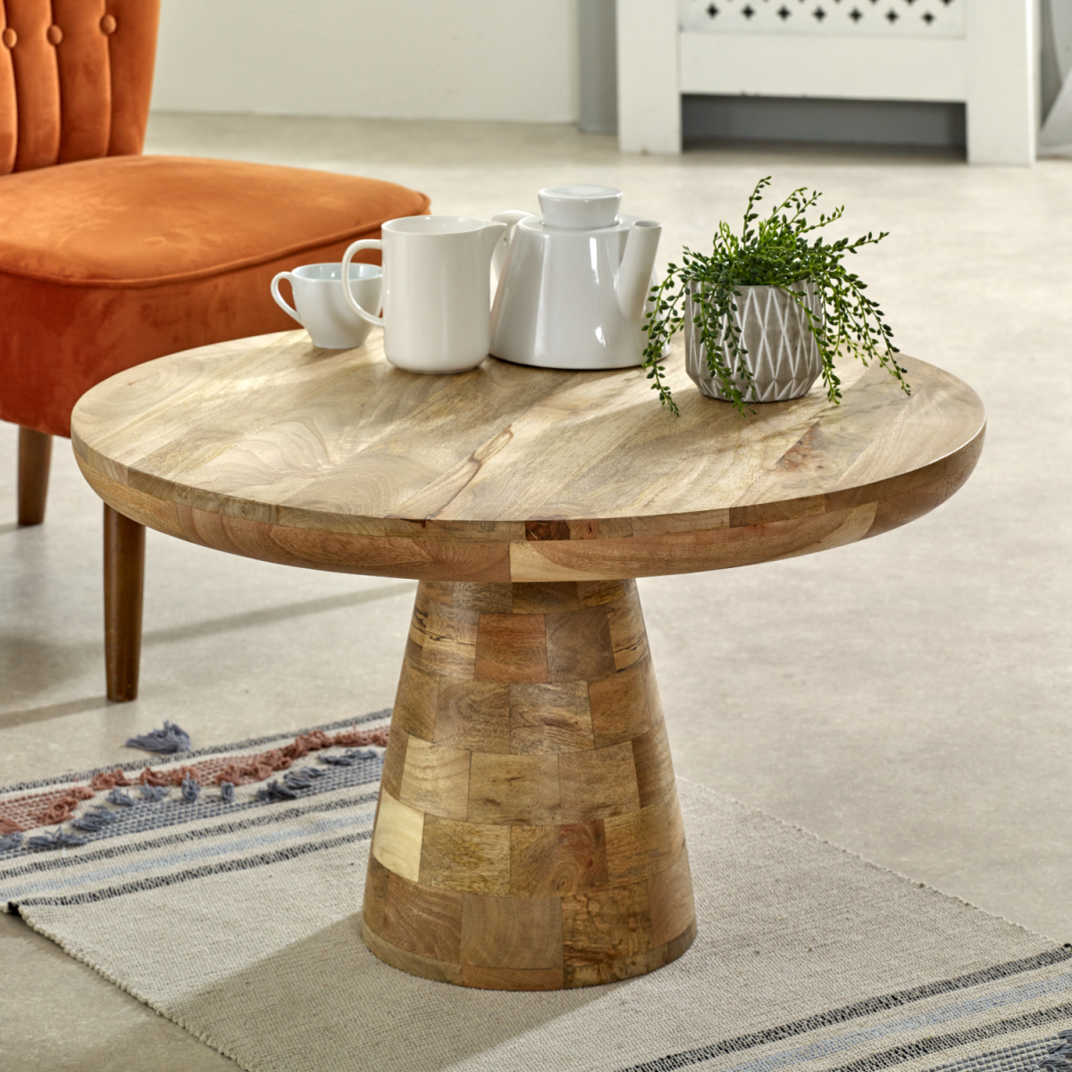 Solid wood Surrey mushroom coffee table by InStock featuring a natural finish and unique mushroom-inspired design in a modern living space.