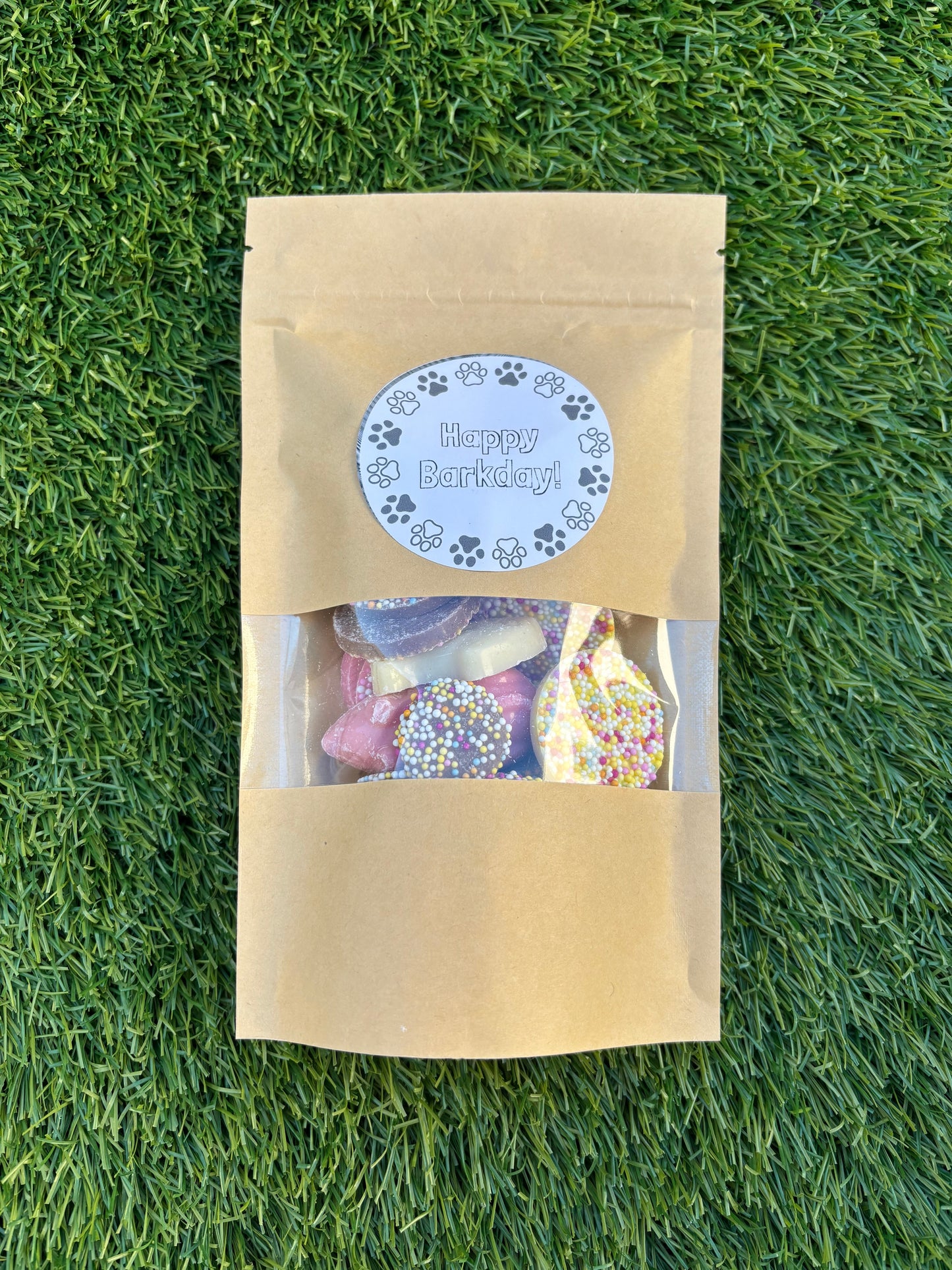 The Bonnie Hound Happy Barkday Treat Pick n Mix Chocolate Treats 150g for dogs, showing assorted chocolate-flavored dog treats.