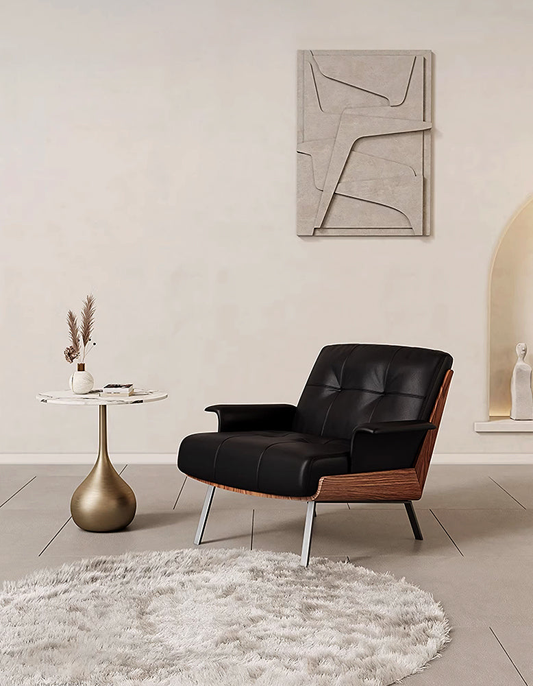 DC Concept Vasilev leather lounge armchair with a modern design and no armrests, featuring a sleek, comfortable seating area.