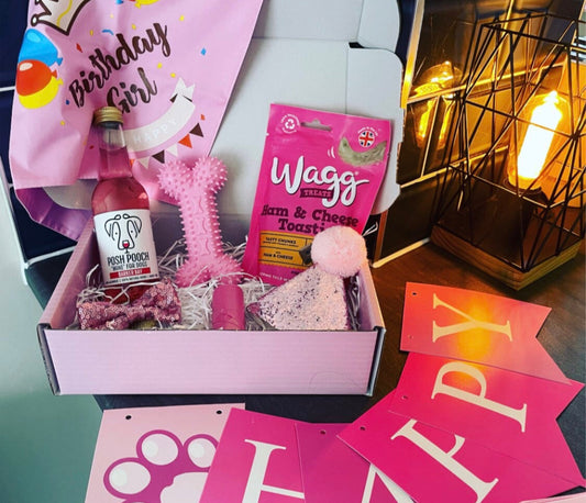 Birthday Girl dog hamper by The Bonnie Hound with treats, toys, and festive decorations for celebrating your dog’s birthday.