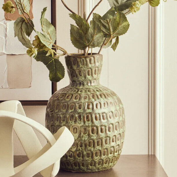 Large green textured ceramic vase by Orsina, showcasing its decorative surface and elegant shape.