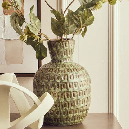 Large green textured ceramic vase by Orsina, showcasing its decorative surface and elegant shape.