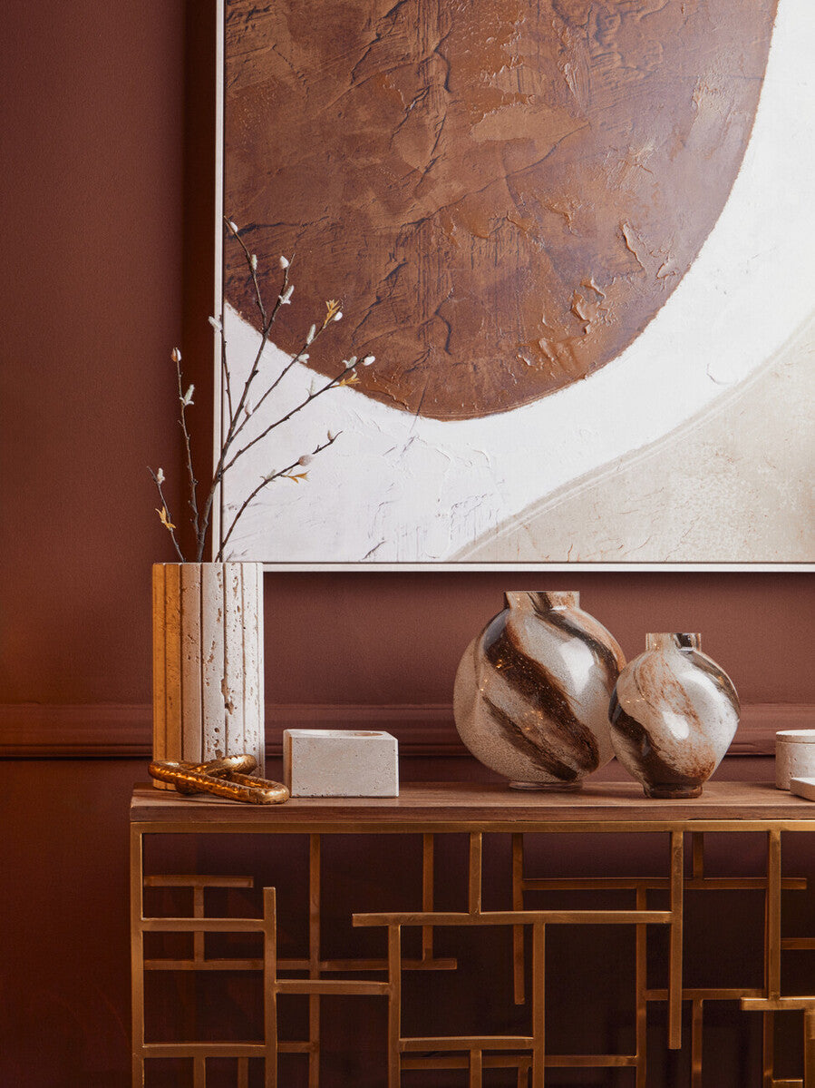 Orsina Tibor Travertine Ribbed Vase with textured surface and neutral tones, ideal for decorative floral arrangements.