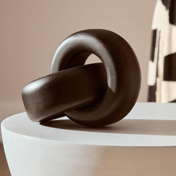 Small black wood knot sculpture from Orsina, decorative knot decor piece for modern interior accents.