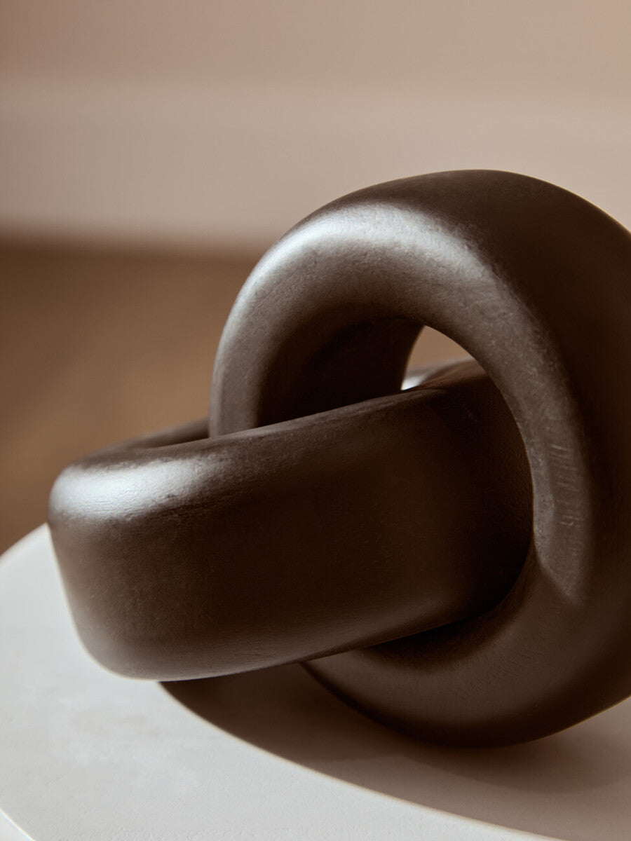 Small black wood knot sculpture from Orsina, decorative knot ornament perfect for modern interior decor.