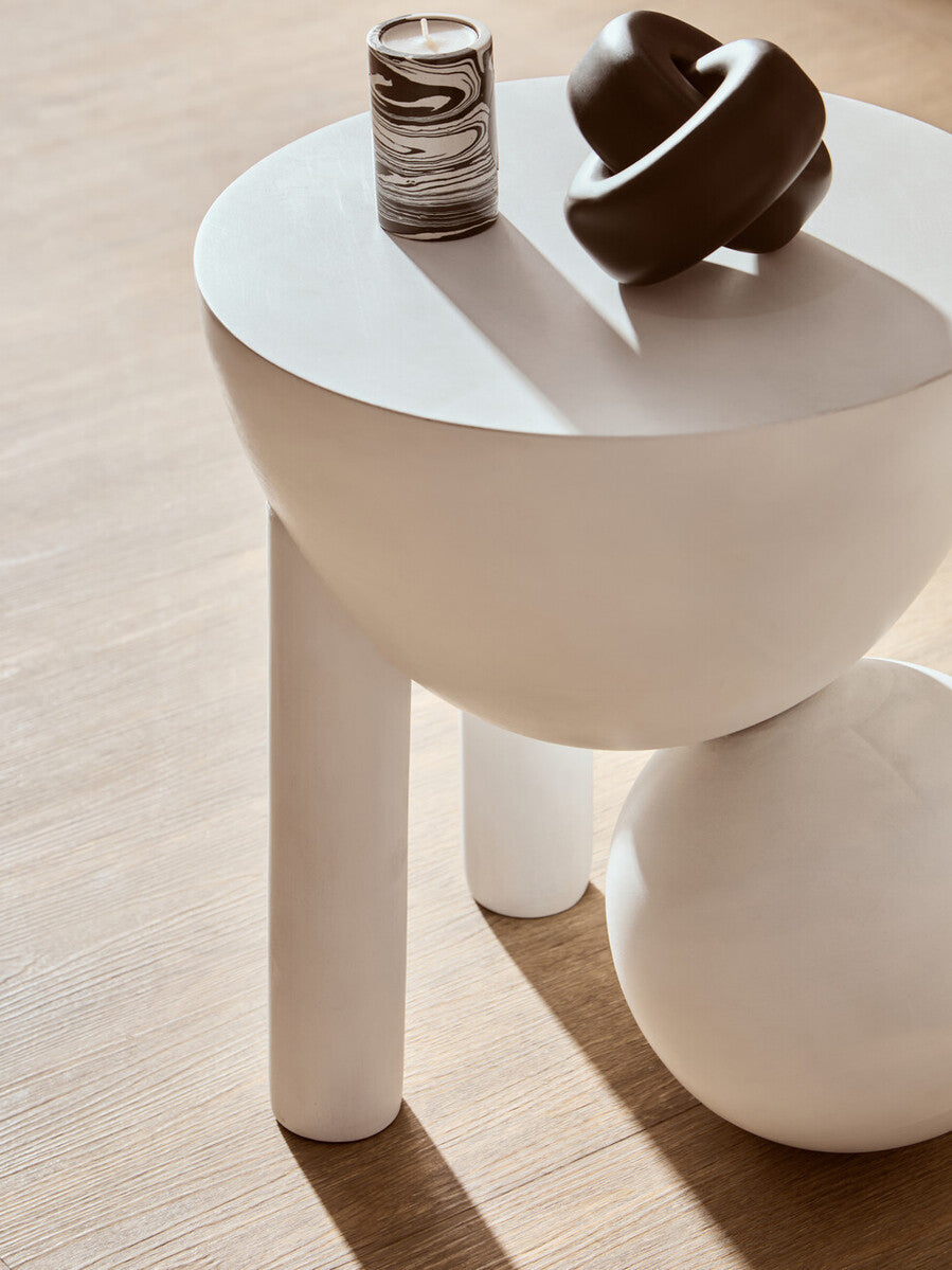 Small black wood knot sculpture by Orsina, showcasing a natural textured design for decorative home accents.