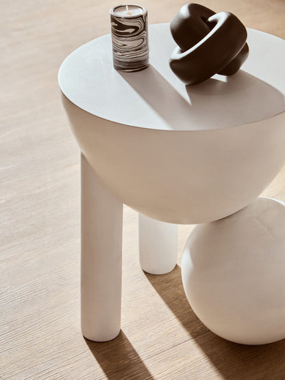 Small black wood knot sculpture by Orsina, showcasing a natural textured design for decorative home accents.