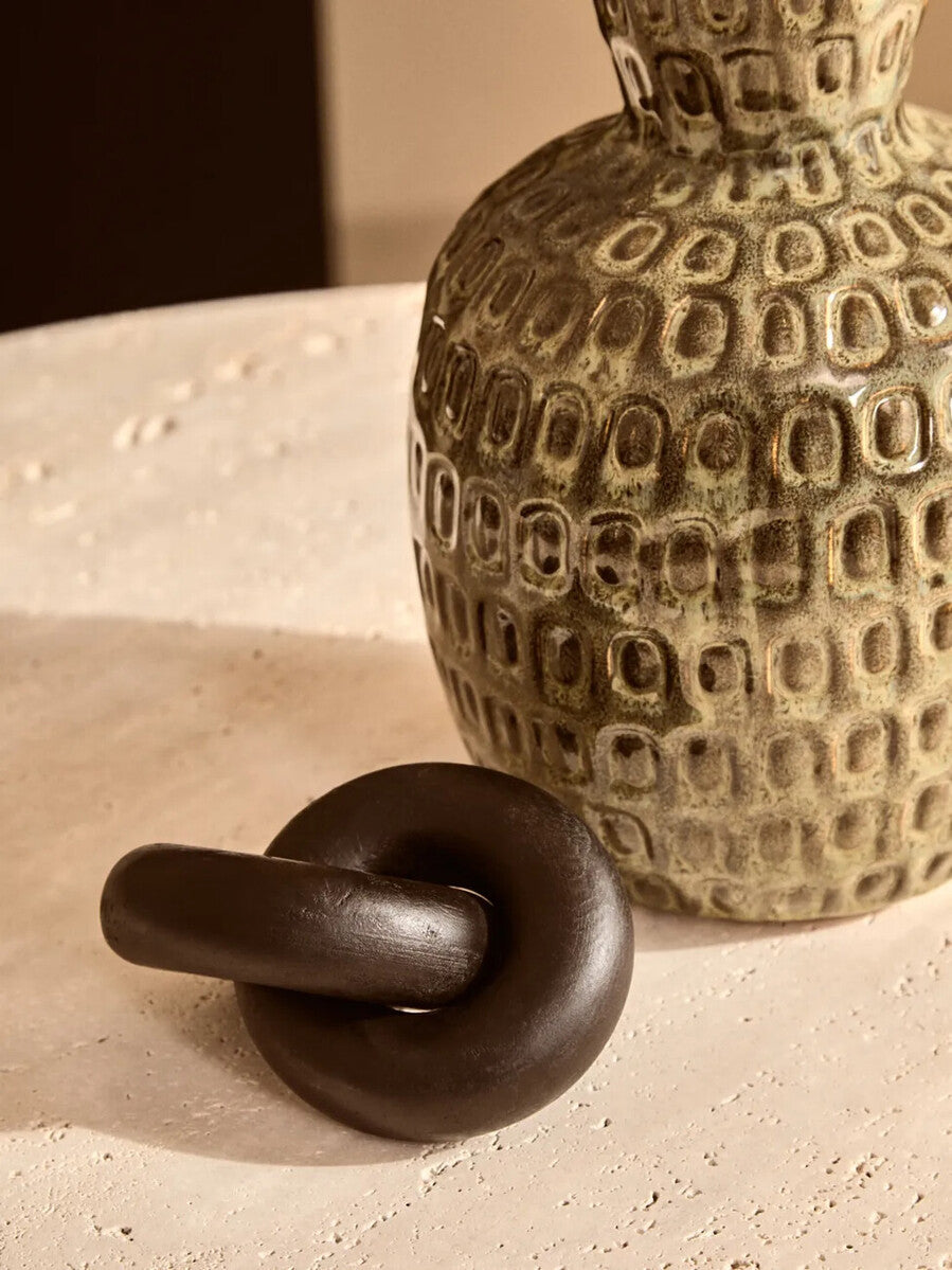 Orsina Cato black wood small knot sculpture, decorative wooden ornament with intricate knot design on a smooth black finish.