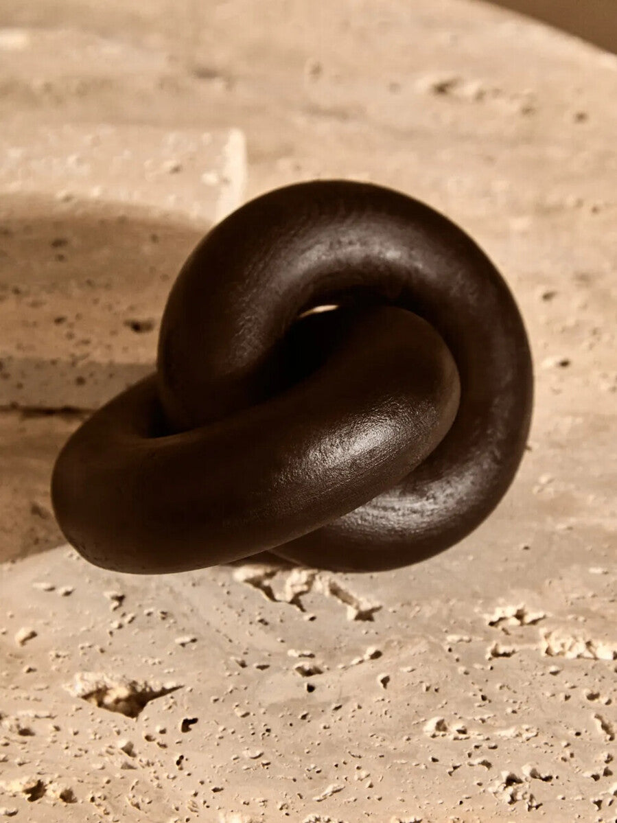 Small black wood knot sculpture by Orsina, decorative knot ornament for modern home decor.