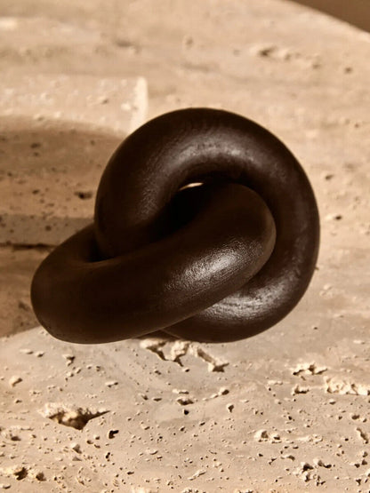 Small black wood knot sculpture by Orsina, decorative knot ornament for modern home decor.