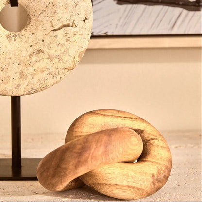 Small natural wood knot sculpture from Orsina, featuring intricate wood grain and organic knot details for decorative use.