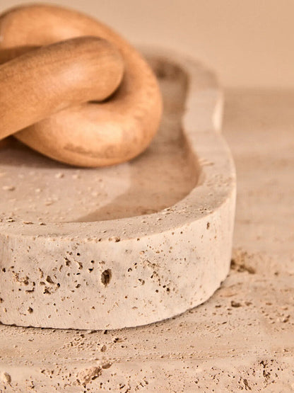 Orsina Cato Natural Wood Small Knot Decor sculpture with intricate wood knot design on a smooth wooden surface.