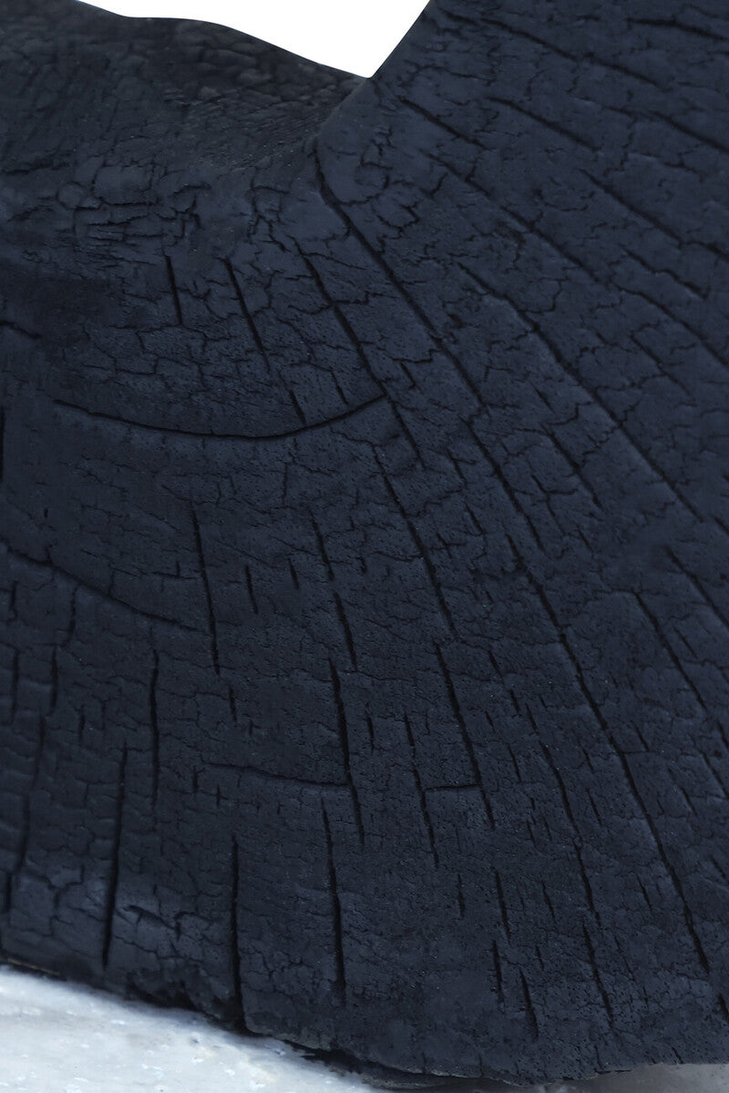 Orsina Tibor black mango wood sculpture with travertine base, modern decorative art piece for home or office.