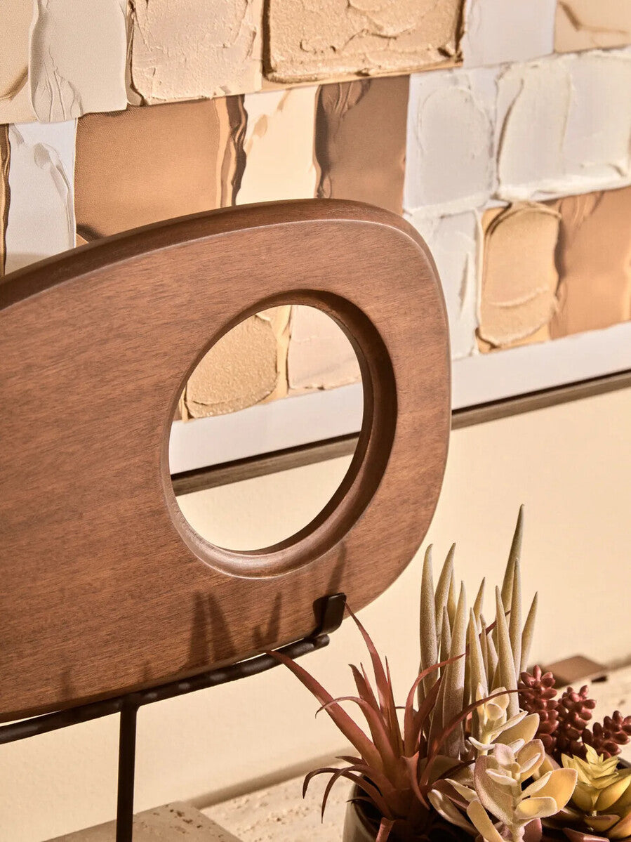 Westo natural wood horizontal sculpture with travertine base by Orsina, showcasing smooth wooden design on a stone foundation.