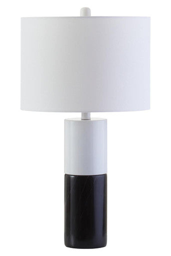 Table lamp with a white shade and black base on a white background