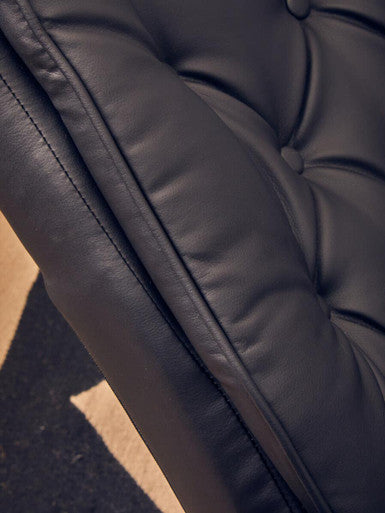 Orsina Warrington black leather effect recliner with matching footstool, designed for office and gaming comfort.