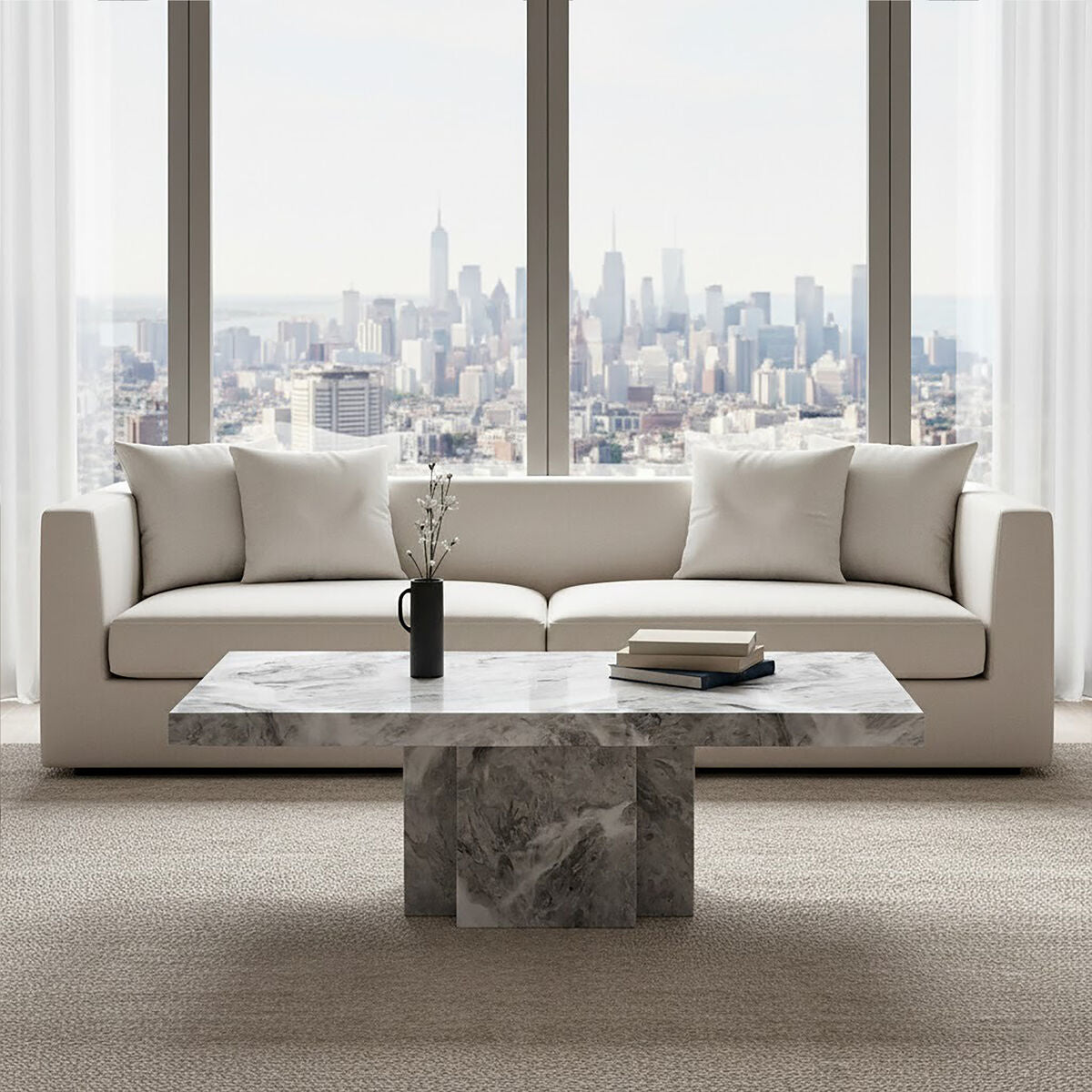 Grey marble top coffee table with pedestal base and silver metal trim by Orsina, modern living room furniture.