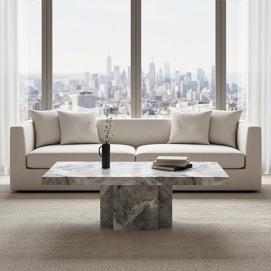 Grey marble top coffee table with pedestal base and silver metal trim by Orsina, modern living room furniture.