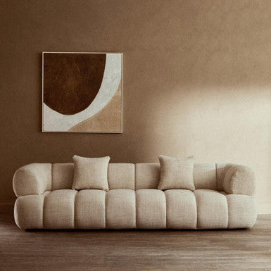 Cream linen 3-seater curved sofa by Orsina with plush cushions and modern design, perfect for contemporary living rooms.