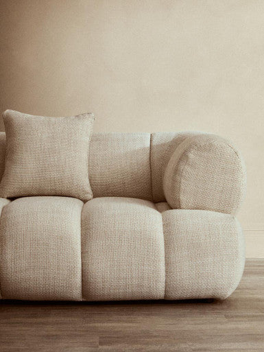 Cream linen 3-seater curved sofa by Orsina, featuring plush cushions and modern design, perfect for contemporary living rooms.