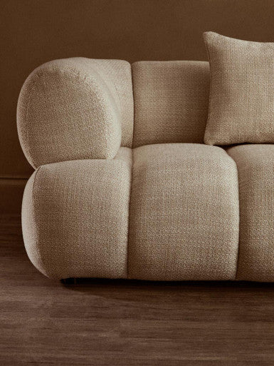 Orsina Ordona 3-seater cream linen curved sofa with plush cushions and modern design, ideal for contemporary living rooms.