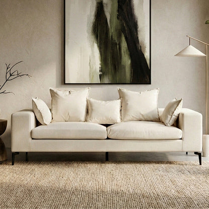 Orsina Avignon 3-seater sofa with textured cream fabric, showcasing plush cushions and modern design.