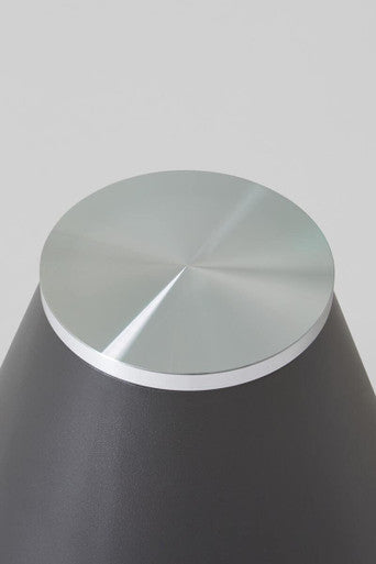 Clear glass round top coffee table with black conical metal base by Orsina, modern living room furniture.