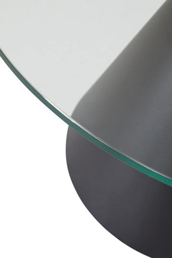 Clear glass round coffee table with black conical metal base by Orsina, perfect for modern living rooms.