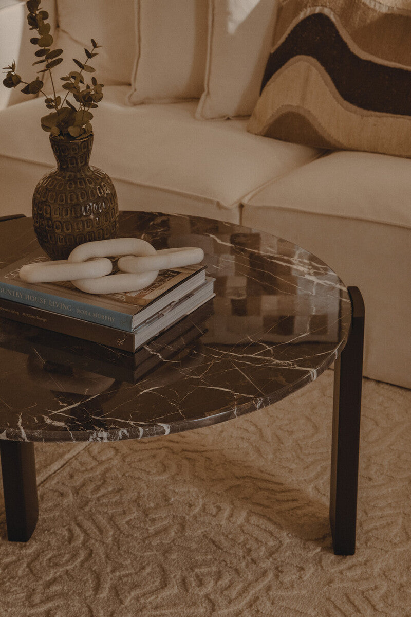 Black round marble top coffee table with black acacia wood legs, Palermo style by Orsina, modern living room furniture.