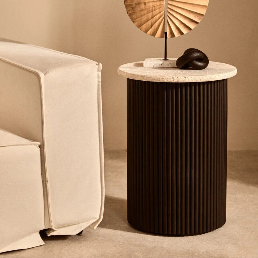 Cream polished travertine top side table with ridged black acacia wood cylindrical base by Orsina Walton.
