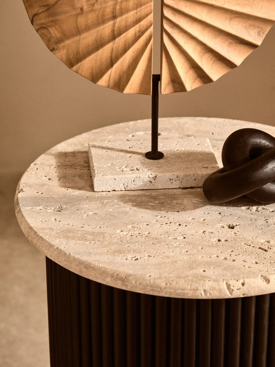 Cream polished travertine side table with ridged black acacia wood cylindrical base, modern Orsina Walton side-tables.