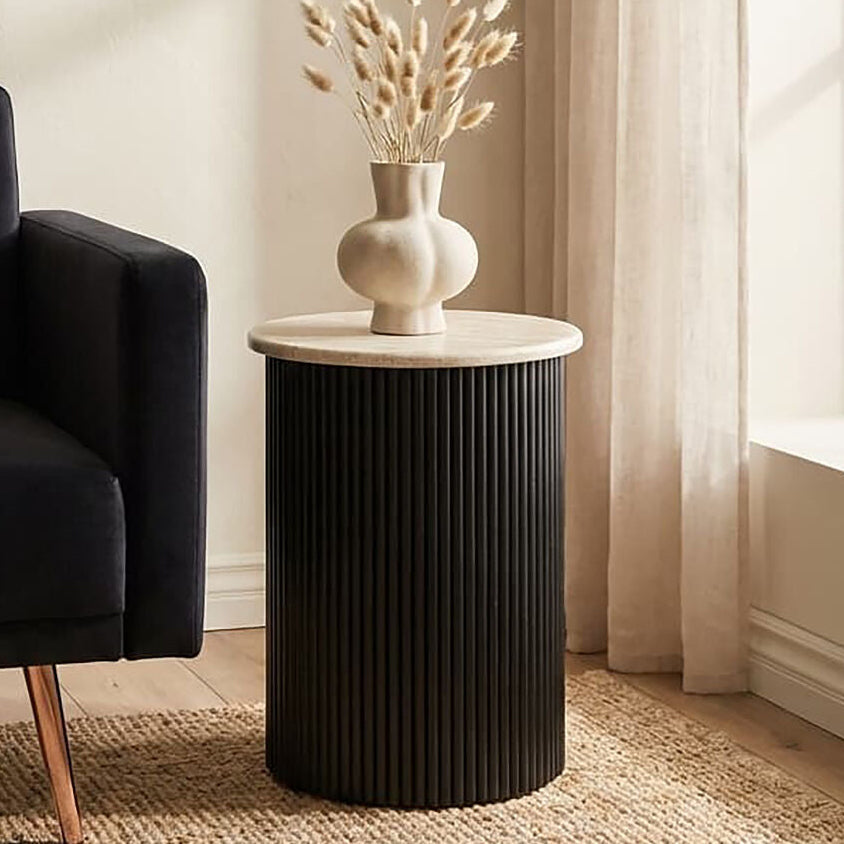 Cream polished travertine side table with ridged black acacia wood cylindrical base by Orsina Walton.