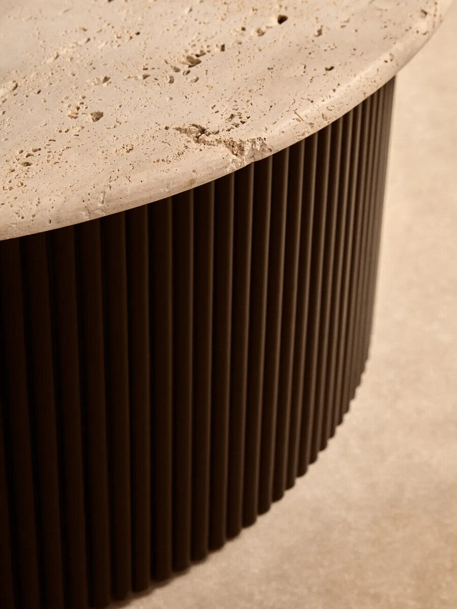 Cream polished travertine top coffee table with ridged black acacia wood drum base by Orsina.