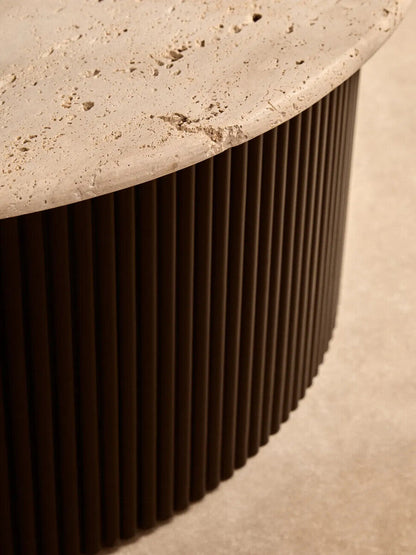 Cream polished travertine top coffee table with ridged black acacia wood drum base by Orsina.