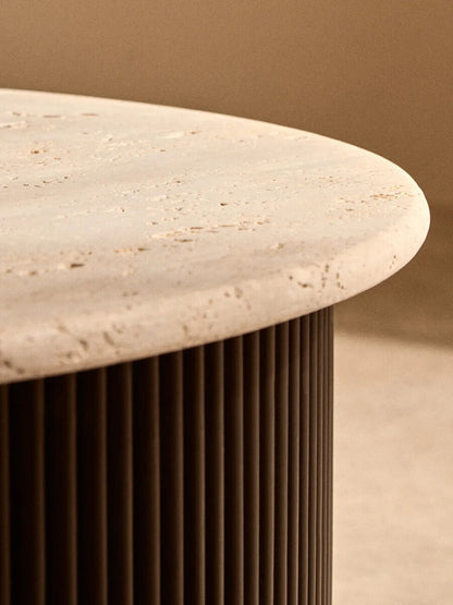 Cream polished travertine top coffee table with ridged black acacia wood drum base by Orsina.
