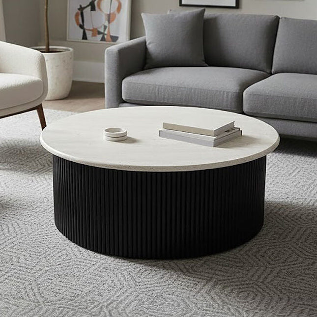 Cream polished travertine top coffee table with ridged black acacia wood drum base by Orsina.