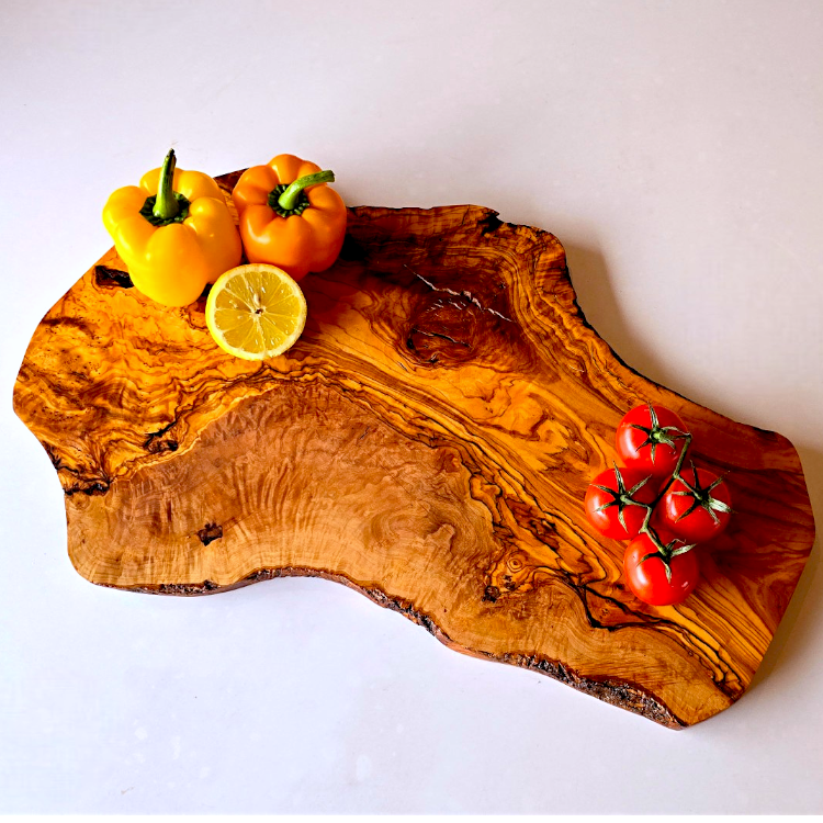 OliveArt large rustic handcrafted olive wood charcuterie board with an irregular shape and natural wood grain detail.