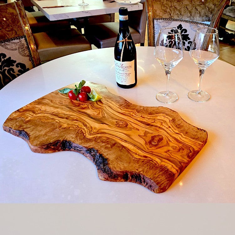 OliveArt large rustic olive wood charcuterie board with irregular shape, handcrafted for serving cheese and appetizers.